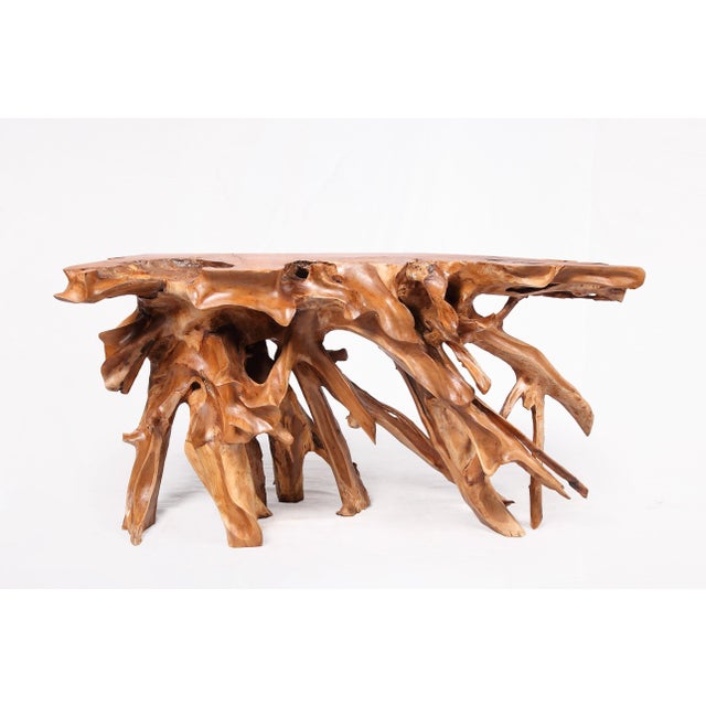 Inspired by the beauty of natural root form, this organic teak console table is handcrafted from one piece of salvaged...