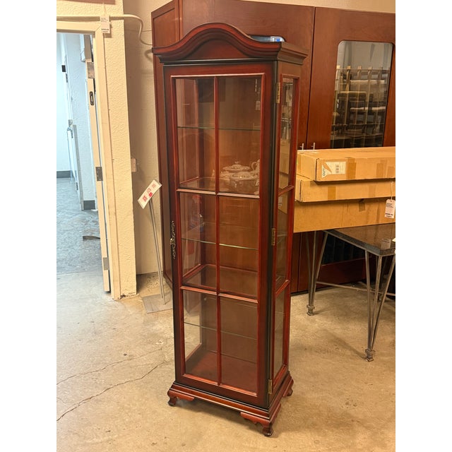 Design Plus Gallery presents a Curio Cabinet from Bombay Company. This traditional curio cabinet is made of wood and...