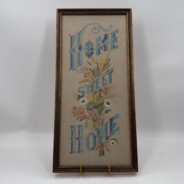 Vintage hand-stitched "Home Sweet Home" embroidery sampler worked on natural linen. The elongated design features ornate...