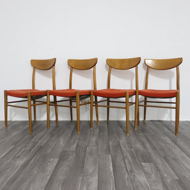 An elegant set of four Scandinavian-style dining chairs dating back to the 1960s. The frame is made of solid wood with...