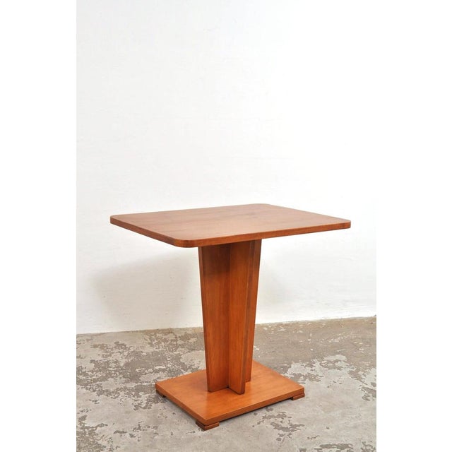 Special Art Deco coffee table from the 1930s. Beautiful design in cherry wood. Can also serve well as a side table. In...