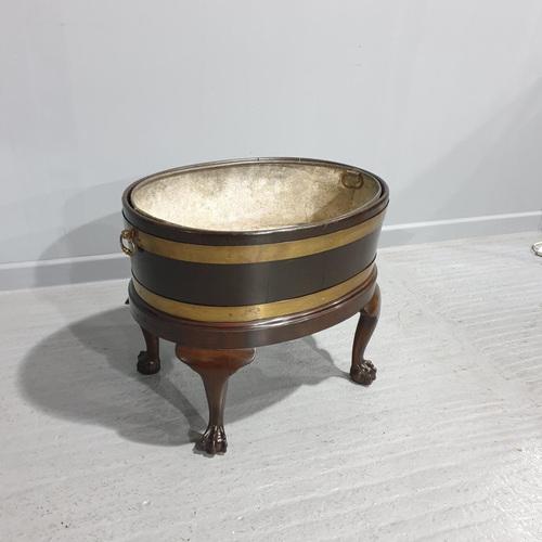 This is a very nice 18th Century Georgian antique mahogany wine cooler or planter, brass bound, standing on ball and claw...