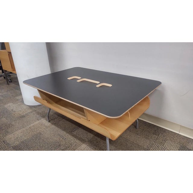 Vintage Herman Miller Eames Komatsu Molded Plywood Magazine Coffee Table - black top, maple base, silver legs. Dimensions...