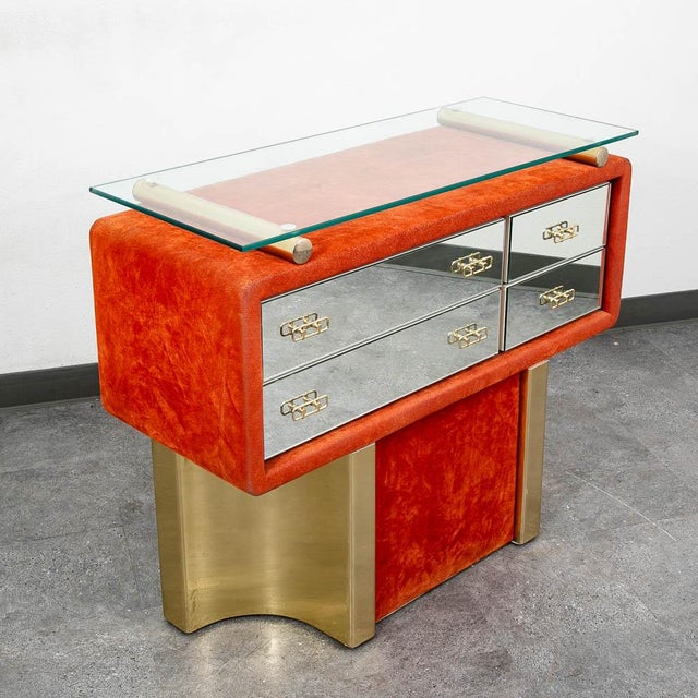 1970s Italian entryway cabinet with mirrored front drawers and orange velvet detailing. Glass top surface suctions to the...