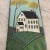 Unique rendering of a country manor house hand-painted on a piece of slate, with an attached suede cord for hanging. This...