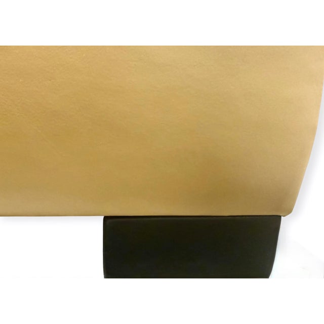 Custom upholstered leather ottoman by world-renowned Danny Cannon Custom Upholstery, Inc. Finished in supple camel-toned...