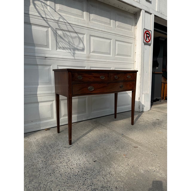 We have a beautiful antique Federal Revival mahogany bow front sideboard for sale, dating to the early 20th century and...