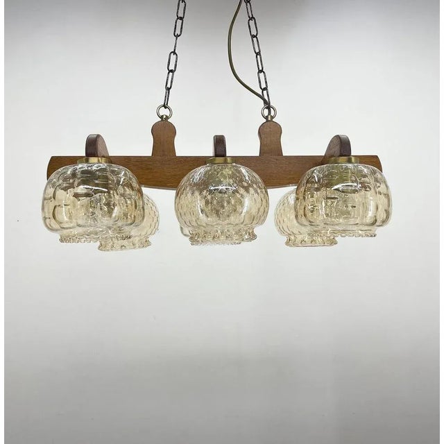 Vintage wooden chandelier made of wood and glass in former Czechoslovaia in the 1970s. Bulbs: 6 x E25-E27. Up to 250V...