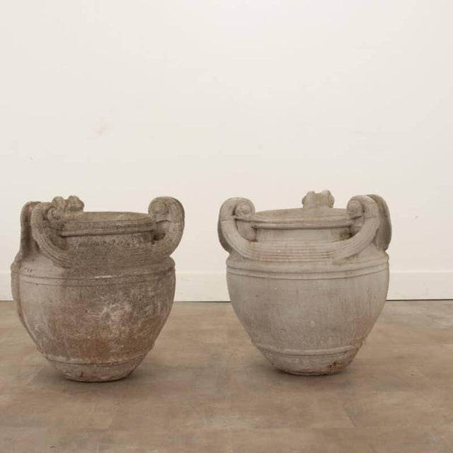 Dimensions: 22-½”H x 22”Diameter A wonderful pair of reconstituted stone planters from 19th century England. Classical in...