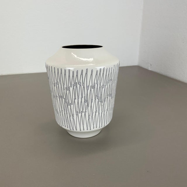 Article: Pottery ceramic vase Producer: ILKRA Ceramics, Germany Decade: 1970s Original vintage 1970s pottery ceramic vase...