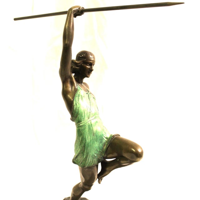 A very well cast sculpture of a Female Athlete in full action pose. Title is (Amazone Au Javelot ) in French. The Amazon...