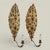 Standout pair of antique neoclassical Italian one light wall sconces crafted in brass hammered into dramatic floral forms...