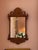 A charming 19th-century American wall mirror crafted in beautifully figured maple, dating to approximately 1840–1860. The...