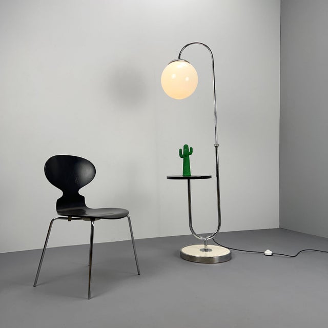 Vintage Steel Tube Floor Lamp with Integrated Table, 1920s, in Restored conditions. Designed 1920 to 1949 European Plug...