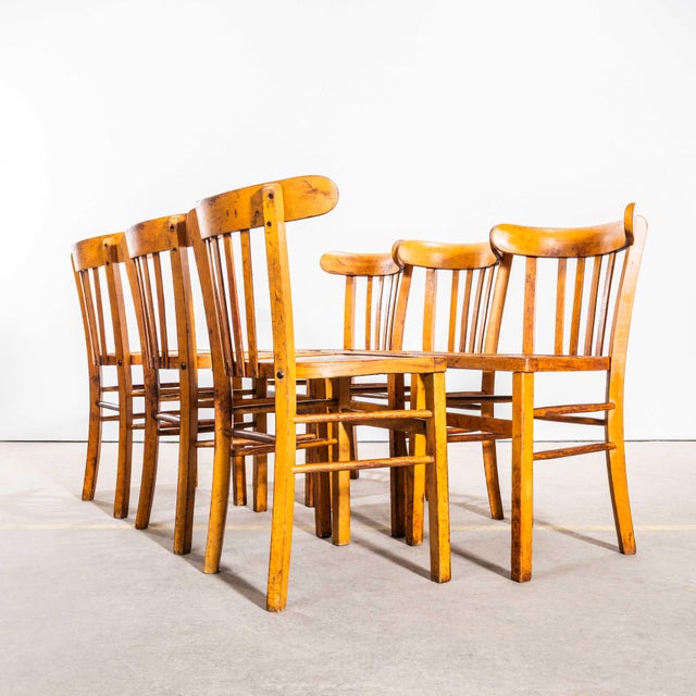 1950’s Warm Blonde Luterma Farmhouse Dining Chairs. - Set Of Six. The process of steam bending beech to create elegant...