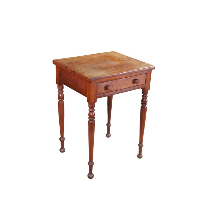 Antique early American country farmhouse parlor side table. Made of cherry featuring square form with one drawer and long...