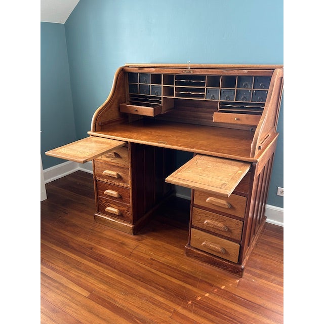 Rare Myrtle Desk (early 1900s) S-curve tambour roll top solid oak desk. Raised panel detail on sides, back and knee hole....