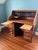 Rare Myrtle Desk (early 1900s) S-curve tambour roll top solid oak desk. Raised panel detail on sides, back and knee hole....