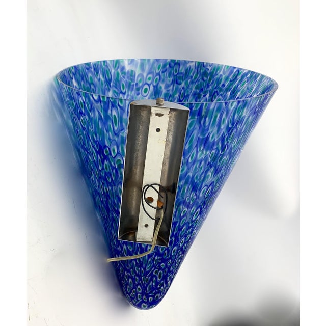 Doge model wall light characterized by a hand-blown Murano glass diffuser with murrina decoration in shades of blue, green...