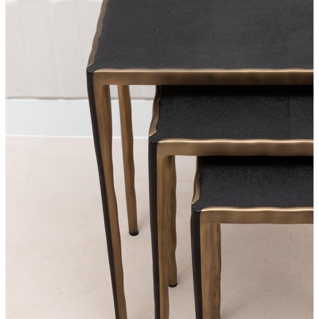 The "Melting Nesting Tables" by R&Y Augousti are a captivating trio of side tables that blend form and function with an...