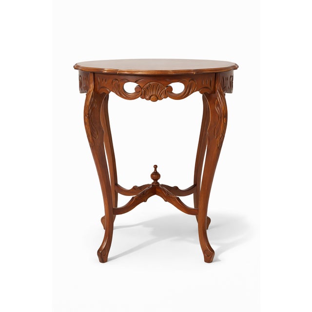 Beautiful walnut lamp table with a fluted round top. Geometric line details across the top. Pretty cabriole legs. The...