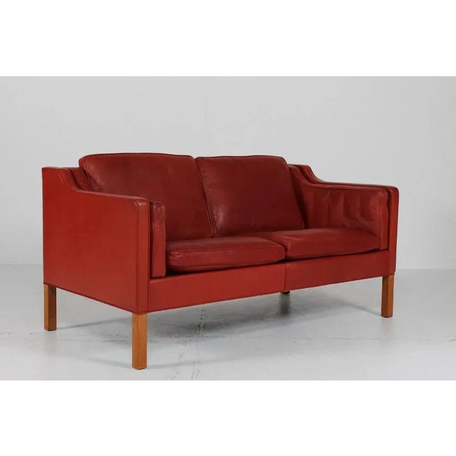 Danish vintage Børge Mogensen sofa 2-seater model no. 2212. It's upholstered with the original reddish brown leather. The...
