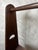 An elegant walnut coat rack dating from the 1960s, with clean lines typical of Scandinavian design and post-war modernism....