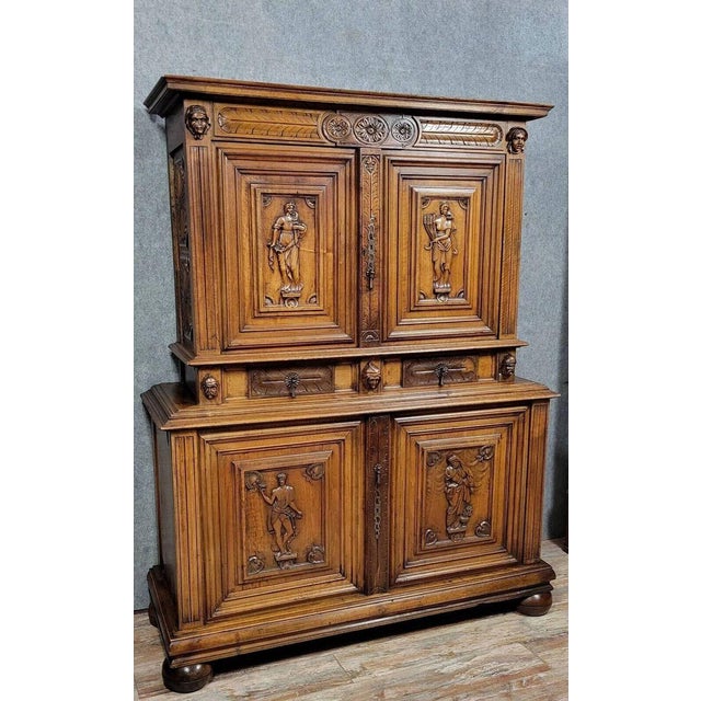 A 17th-century bellifontaine cabinet with four doors, crafted from solid walnut. the front opens with four doors decorated...