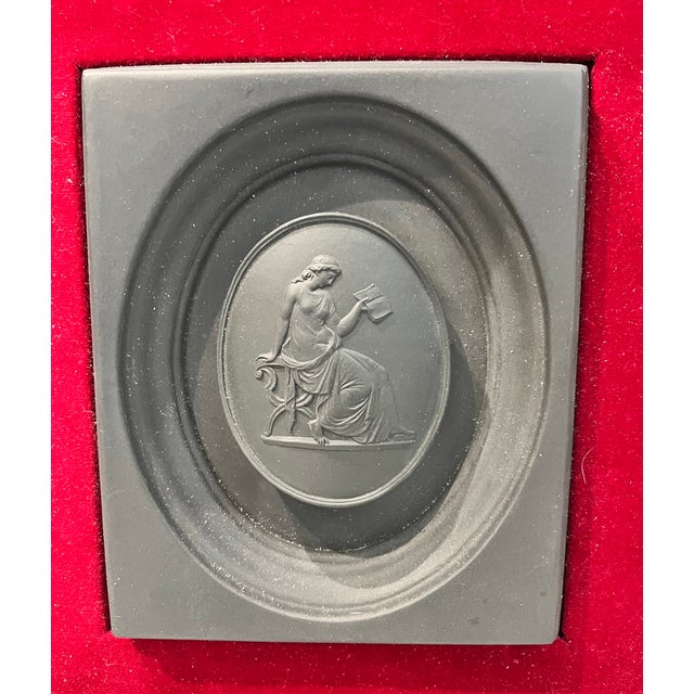 This framed black basalt neoclassical plaque is from the 20th century. Created by W. Jubin, in the manner of Wedgewood...