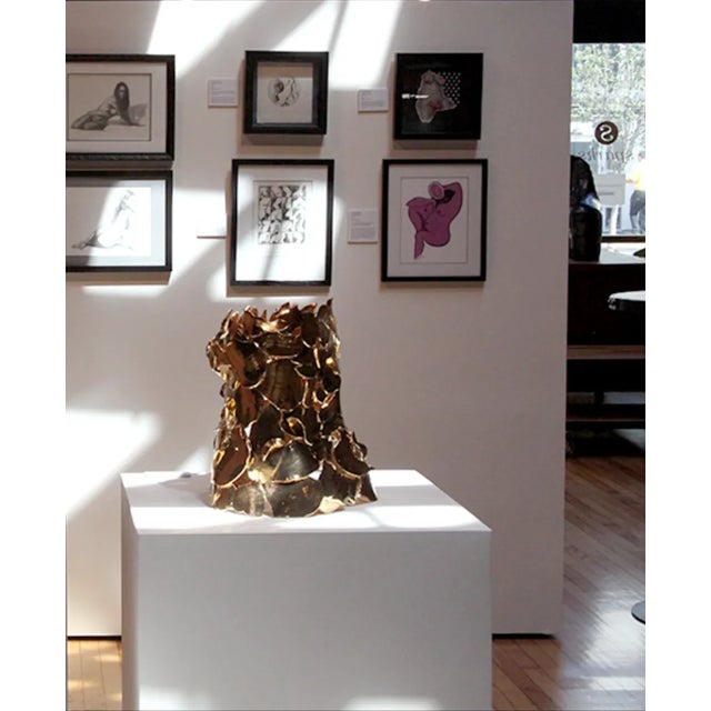 A 10" x 16" x 11" Expressionist Ceramic Porcelain and 22k Gold Sculpture executed by artist Linda Litteral. A certificate...