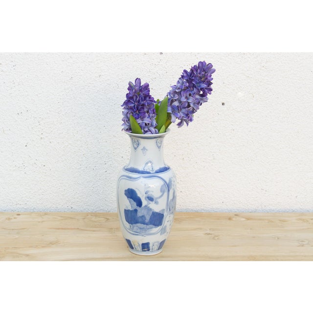 A vase like this carries its decoration the way a good story carries a reader, one reserve panel doing all the work. Set...