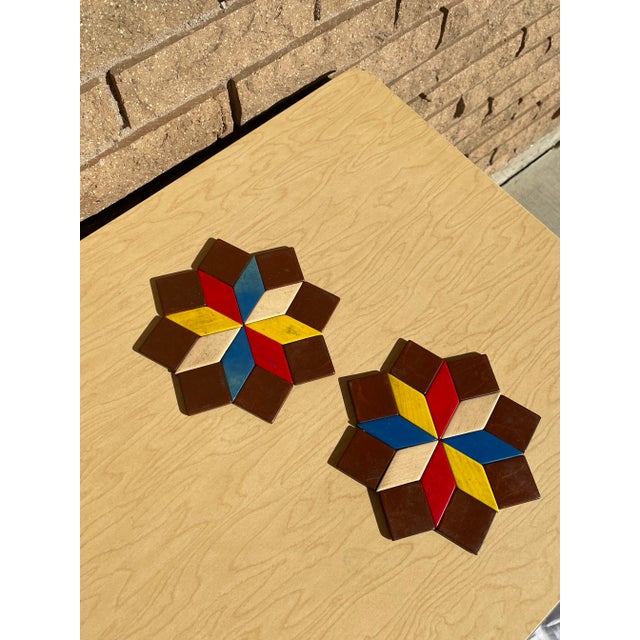 Beautiful West German made painted wood star coasters. Striking triadic color scheme with tan and brown accents. Light...