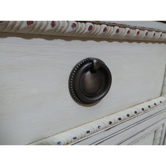 This is a unique Gustavian Style 9 drawer Dresser. Its been restored and repainted with Milk Paints "Oyster White"