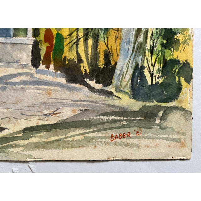 This impressionist watercolor is of a mountain house or house in a wooded area with snow, silhouettes of people, and a...