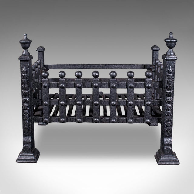 This is an antique fire basket. An English, wrought iron fireplace grate, dating to the late Victorian period, circa 1885....