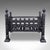 This is an antique fire basket. An English, wrought iron fireplace grate, dating to the late Victorian period, circa 1885....
