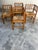 A beautiful set of four solid oak brutalist armchairs from the 1950s, featuring handwoven rush seats and a strong...