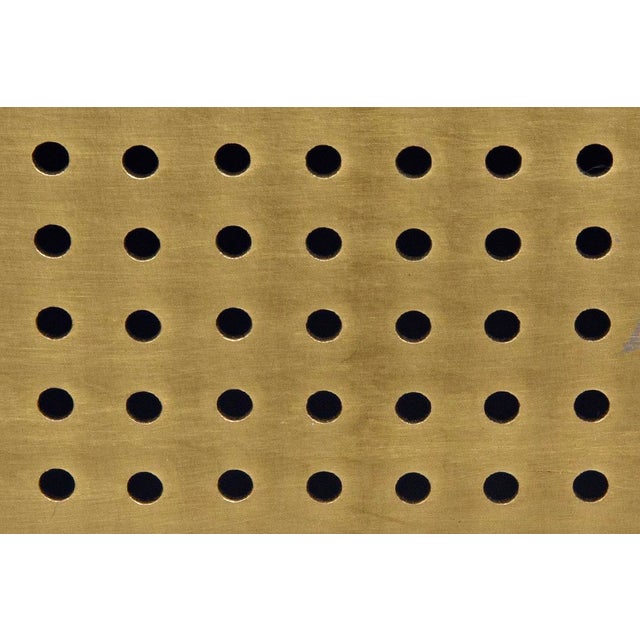 A strong cast iron pyramid inspired base, finished in antiqued brass, contrasts perfectly with a crisp white square slab...