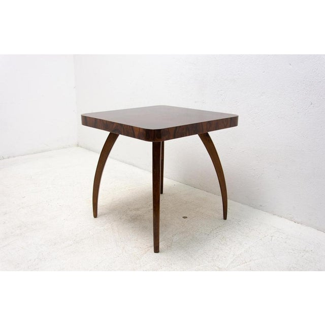 Square coffee table in the shape of spider designed by Jindrich Halabala, with distinctive curved legs, rounded corners....