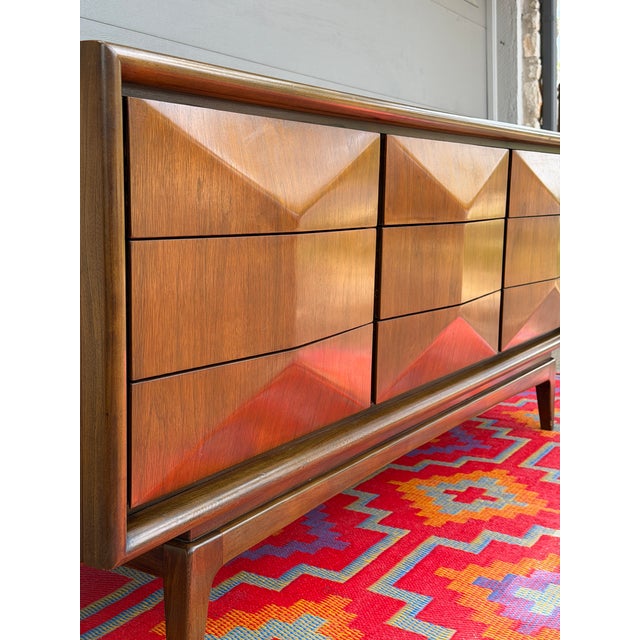 Absolutely stunning mid-century modern lowboy dresser by United Furniture Co., Attributed, featuring the highly sought-...