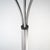 A three-arm chrome-plated metal floor lamp from the 1970s, a design that interprets light as a compositional element...