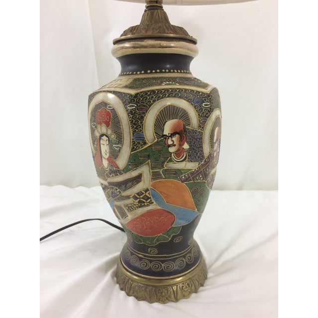 This fantastic lamp dates from ca. 1912. Newly rewired with new shade. The shade measures 17" in diameter; the base is 7"...