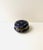 An elegant dark blue round porcelain jewelry box with raised gold gilt decoration, Neoclassical design style, circa...