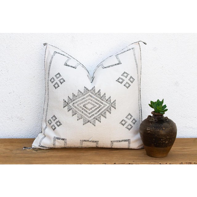 Make a graphic statement with this handcrafted Moroccan cactus silk pillow, measuring approximately 24 inches square....