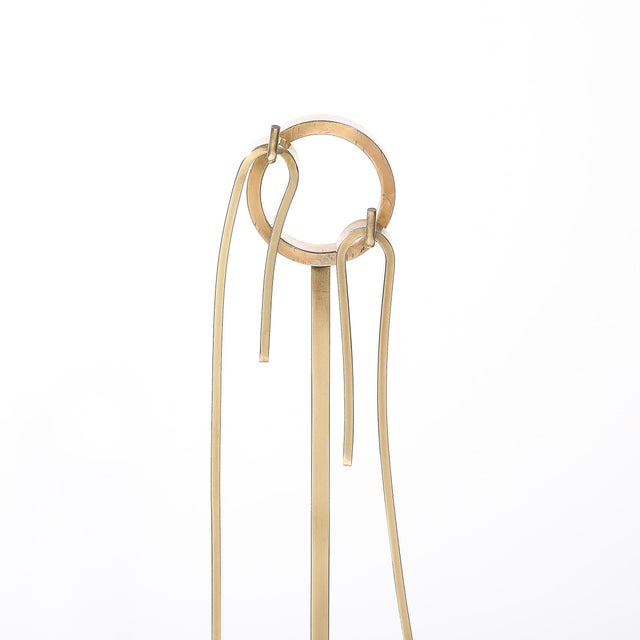 This remarkable fire tool set, designed by the influential Donald Deskey, showcases exceptional Mid-Century Modernist...