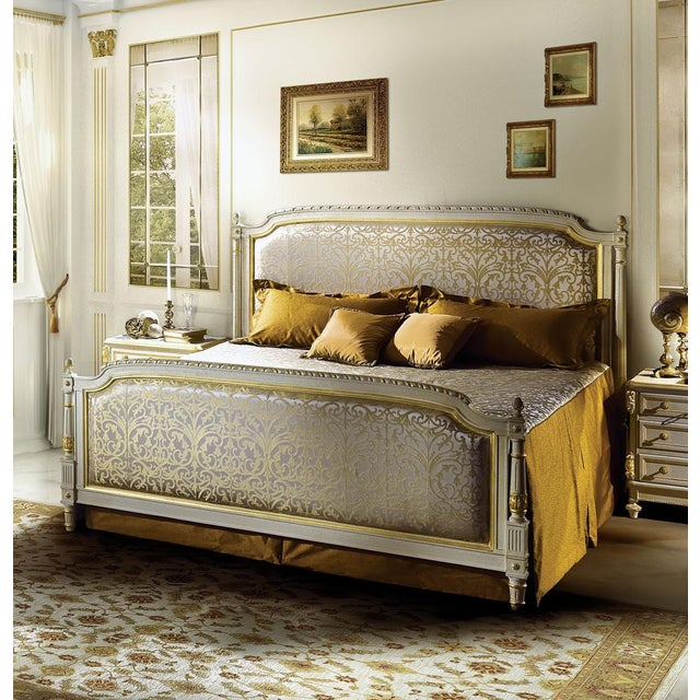 Handcrafted in Italy, this Louis XVI king size bed features a glazed white finish with 24-karat gold leaf accents. The...