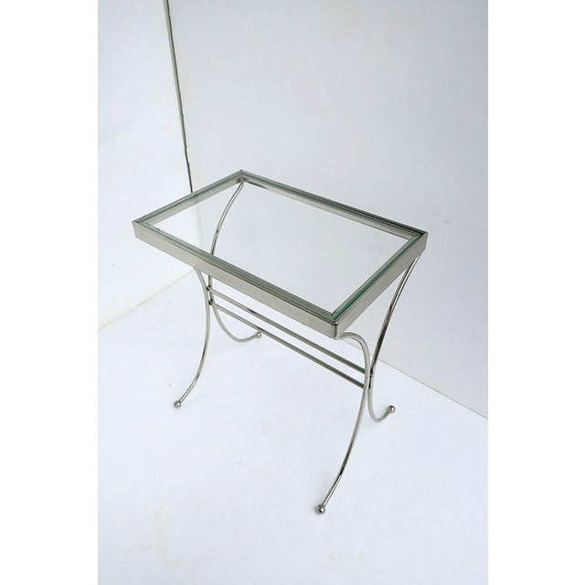 A rectangular chrome and glass side drinks table, Midcentury Modern design period, circa mid-20th century. Chrome frame...