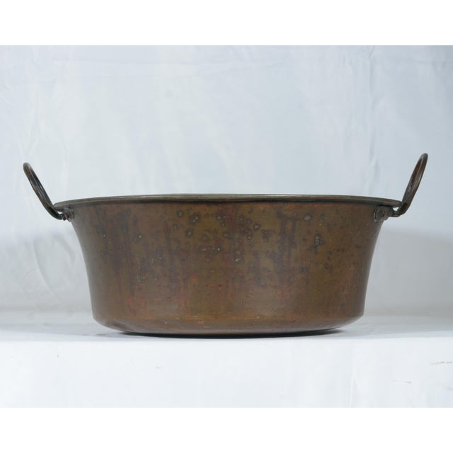 This large antique copper basin was handcrafted in Italy during the 19th century using traditional hand-hammering...