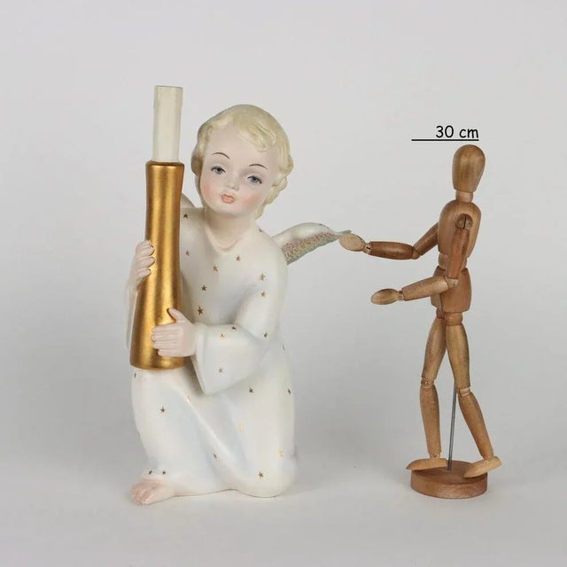 Colaggio ceramic sculpture depicting Angioletto with candle. Under the brand of the manufacture brand. This piece is...