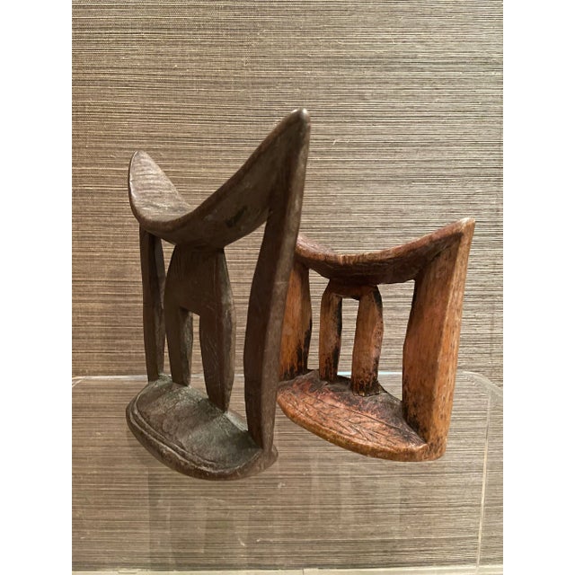 A pair of Ethiopian headrests from the Arussi people. Elegant and modern form with a fantastic waxy patina, these were...